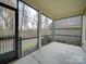 Spacious screened porch overlooking a wooded area at 15334 S Birkdale Commons Pkwy, Huntersville, NC 28078