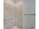 Tiled shower with grab bars and built-in shelf at 15334 S Birkdale Commons Pkwy, Huntersville, NC 28078