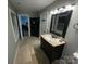 Bathroom with vanity and a view into another room at 506 S Love Chapel Rd, Stanfield, NC 28163