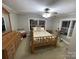 Charming bedroom with hardwood floors and a full bed at 506 S Love Chapel Rd, Stanfield, NC 28163