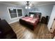 Bright bedroom with hardwood floors and large window at 506 S Love Chapel Rd, Stanfield, NC 28163