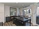 Dining area with dark wood table, bench seating and sliding doors to deck at 51 Old Post Rd, Lake Wylie, SC 29710