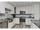 Updated kitchen with white shaker cabinets, stainless steel appliances, and granite countertops at 51 Old Post Rd, Lake Wylie, SC 29710