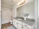 Bathroom with granite countertop, white cabinets, and a shower/tub combo at 5110 Pansley Dr, Charlotte, NC 28226