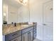 Bathroom with granite countertop and dark brown vanity at 5110 Pansley Dr, Charlotte, NC 28226