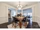 Bright dining area with marble table and view into living room at 5110 Pansley Dr, Charlotte, NC 28226