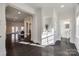 Bright entryway with dark hardwood floors and powder room at 5110 Pansley Dr, Charlotte, NC 28226