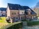 Home's back exterior, featuring patio and fenced yard at 5110 Pansley Dr, Charlotte, NC 28226