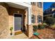 Gray front door with welcome mat and brick facade at 5110 Pansley Dr, Charlotte, NC 28226