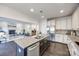 Kitchen boasts an island with granite countertops and stainless steel appliances at 5110 Pansley Dr, Charlotte, NC 28226