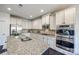 Kitchen island with granite countertop, double sink, and ample storage at 5110 Pansley Dr, Charlotte, NC 28226