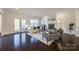 Cozy living room with fireplace, hardwood floors, and french doors at 5110 Pansley Dr, Charlotte, NC 28226