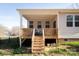 Backyard view with wooden deck and stairs at 5120 Kings Pinnacle Dr, Kings Mountain, NC 28086