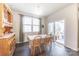 Bright dining area with hardwood floors, a wooden hutch, and access to a deck at 5120 Kings Pinnacle Dr, Kings Mountain, NC 28086