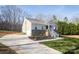 Front view of house with driveway and landscaping at 5120 Kings Pinnacle Dr, Kings Mountain, NC 28086