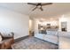 Open living room features a neutral color palette, plush seating, and a view into the kitchen at 5120 Kings Pinnacle Dr, Kings Mountain, NC 28086