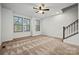 Bedroom features neutral carpeting, three windows, and white trim throughout at 547 Old Mill Rd, Charlotte, NC 28206