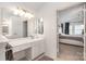 Bright bathroom with double vanity and large mirror at 6239 Oxwynn Ln, Charlotte, NC 28270