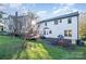 Two-story house with deck and playset in the backyard at 6239 Oxwynn Ln, Charlotte, NC 28270