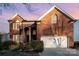 Two-story brick house with a large front yard at 6239 Oxwynn Ln, Charlotte, NC 28270