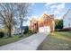 Brick house with a two-car garage and driveway at 6239 Oxwynn Ln, Charlotte, NC 28270