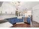 Modern kitchen with stainless steel appliances and blue cabinetry at 6239 Oxwynn Ln, Charlotte, NC 28270