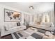 Bright living room featuring hardwood floors and large windows at 6239 Oxwynn Ln, Charlotte, NC 28270