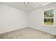 Spacious bedroom featuring gray carpeting and a window at 8508 Sunflower Rd, Charlotte, NC 28227