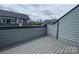 Spacious balcony with composite deck showcasing Charlotte skyline, providing serene outdoor living and city views at 1312 Walter Taylor Way # Eqx0104, Charlotte, NC 28206