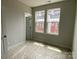 Neutral bedroom featuring a double window and a door at 1312 Walter Taylor Way # Eqx0104, Charlotte, NC 28206