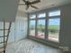 Bright bedroom with three windows, white trim, ceiling fan and closet at 1312 Walter Taylor Way # Eqx0104, Charlotte, NC 28206
