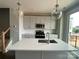 Modern kitchen featuring gray cabinets, stainless steel appliances, a large island, and stylish pendant lighting at 1312 Walter Taylor Way # Eqx0104, Charlotte, NC 28206