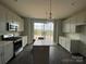 Bright kitchen featuring stainless steel appliances, a center island, and stylish pendant lights at 1312 Walter Taylor Way # Eqx0104, Charlotte, NC 28206