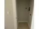 A compact laundry room offers tile floors and essential hookups for convenience at 1312 Walter Taylor Way # Eqx0104, Charlotte, NC 28206