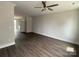 Spacious living room with dark hardwood flooring, recessed lighting, and a ceiling fan at 1312 Walter Taylor Way # Eqx0104, Charlotte, NC 28206