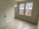 Bedroom featuring two large windows and a door to the closet, enhancing the room's brightness and convenience at 1316 Walter Taylor Way # Eqx0103, Charlotte, NC 28206