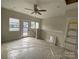 Unfinished bonus room with ample light and ceiling fan, ready for customization at 1316 Walter Taylor Way # Eqx0103, Charlotte, NC 28206