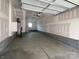 Unfinished two car garage featuring concrete flooring and white walls at 1316 Walter Taylor Way # Eqx0103, Charlotte, NC 28206