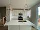 Bright, modern kitchen with a large island, white cabinets, and stainless steel appliances at 1316 Walter Taylor Way # Eqx0103, Charlotte, NC 28206