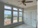 Bedroom featuring large windows offering a view, a ceiling fan, and neutral walls creating a peaceful atmosphere at 1320 Walter Taylor Way # Eqx0102, Charlotte, NC 28206