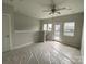 Spacious bonus room features a ceiling fan and access to a private balcony at 1320 Walter Taylor Way # Eqx0102, Charlotte, NC 28206