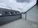 Exterior shot of deck showing roofline of townhomes in a community at 1320 Walter Taylor Way # Eqx0102, Charlotte, NC 28206