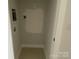 Bright and clean laundry room area complete with tile flooring and utility hookups at 1320 Walter Taylor Way # Eqx0102, Charlotte, NC 28206