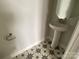 Stylish powder room with pedestal sink, decorative tile floor, and modern fixtures adding a touch of elegance at 1320 Walter Taylor Way # Eqx0102, Charlotte, NC 28206