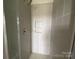 Modern tiled shower with built-in shelving and glass door providing a clean and stylish bathing experience at 1320 Walter Taylor Way # Eqx0102, Charlotte, NC 28206