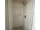 A tiled walk-in shower featuring glass doors and an inset shelf at 1324 Walter Taylor Way # Eqx0101, Charlotte, NC 28206