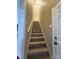 Carpeted staircase leading to the upper level at 13410 Old Camden Rd, Midland, NC 28107