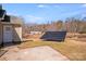 Backyard area with a solar panel and a view of a neighboring home at 150 Windmill Ct, Harmony, NC 28634