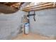 Basement with concrete floor, cinder block walls, and a water filtration system at 150 Windmill Ct, Harmony, NC 28634