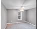 Cozy bedroom with carpeted floors, a ceiling fan, and natural light, creating a comfortable and relaxing retreat at 150 Windmill Ct, Harmony, NC 28634